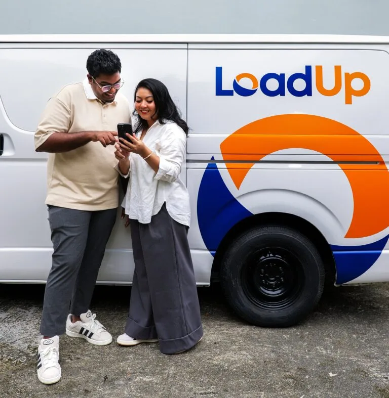 Two friends sharing the LoadUp referral code